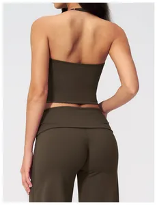 Back view of dark olive green halter yoga top and high-waisted leggings set