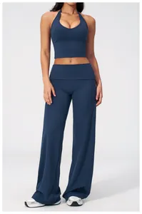 Deep blue yoga set featuring halter back sports bra and high-waist wide-leg pants