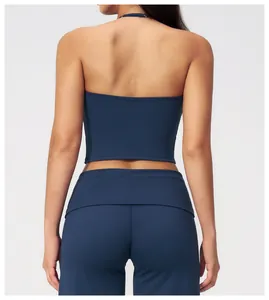 Rear view of navy blue halter yoga top and high-waisted leggings set in matte fabric