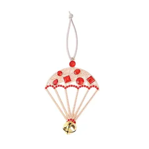 Christmas parachute ornament with red rhinestones and a gold bell for holiday tree decor