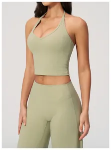 Detail of sage green yoga set showing V-neck halter top and high-waist fitness leggings