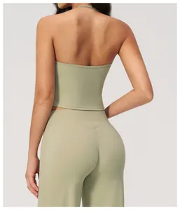 Back view of a backless halter yoga top and matching high-waisted leggings set