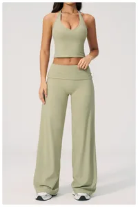 Detailed front view of sage green v-neck halter yoga top and wide-leg sports trousers