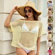 Close-up of the hollow-out crochet knit pattern on this loose-fit beach cover-up