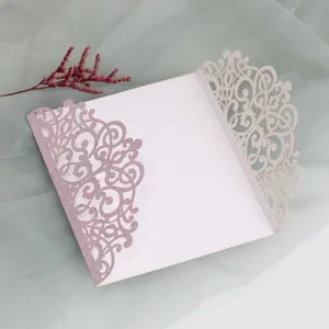 Detail of laser-cut purple glitter invitation shell with elegant floral pattern