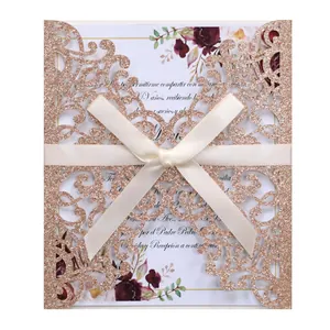 Detail showing laser-cut rose gold glitter cover with an elegant ivory satin bow