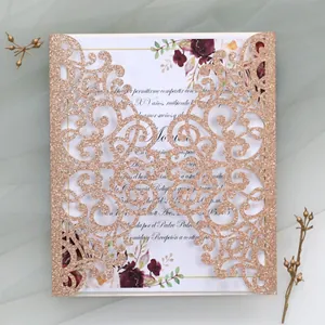 Detailed laser-cut rose gold glitter wedding invitation with floral printed inner card