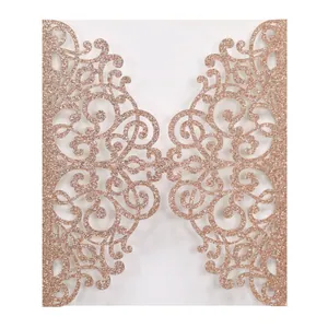 Detail of laser cut hollow invitation cover in rose gold glitter finish paper