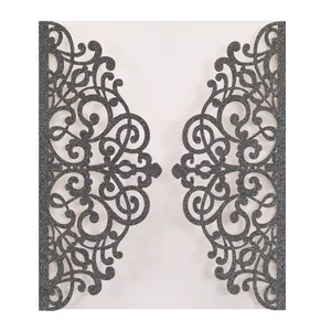 Detail of laser-cut grey invitation card with shimmering glitter coating texture