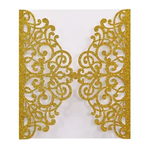 Detailed laser-cut vine patterns on gold glitter paper invitation cover sleeve