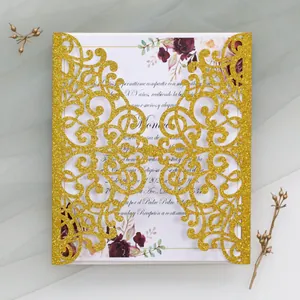 Detail of laser cut gold glitter invitation with floral pattern for Quinceañera