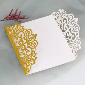 Macro detail of laser-cut glitter invitations with elegant floral patterns for weddings