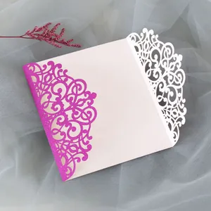 Detailed laser-cut hollow pattern with pink glitter on wedding invitation envelope