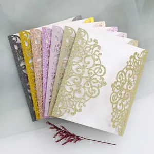 Detailed laser-cut glitter wedding invitation covers in various metallic colors