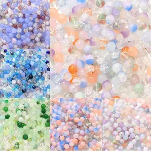 Macro detail of colorful DIY glass beads with cracked and frosted textures for jewelry