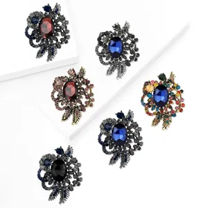 Set of six vintage alloy brooches with oval gemstones and crystals for formal attire