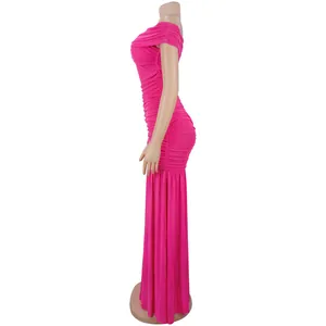 Detail view of ruched bright pink off-shoulder bodycon midi dress in a slim fit silhouette