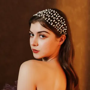 Close-up of multi-layer pearl mesh headband on model showing elegant bridal styling