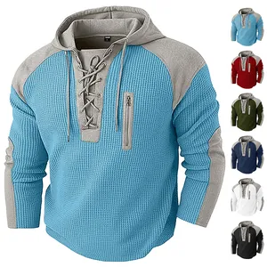 Detail of waffle texture fabric and vertical zipper pocket on men hoodie