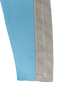 Close-up of blue waffle knit and grey fabric stitching with double needle stitching
