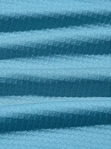 Macro view showing the blue waffle knit fabric texture and horizontal striped pattern