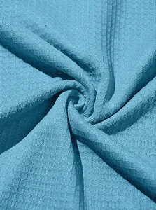 Detailed texture of the sky blue waffle knit fabric on this men's casual drawstring hoodie