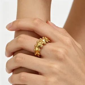 Luxurious gold adjustable ring with pyramid rivet design and beaded edges for men and women