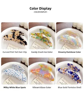 Detail view of colorful acetate fisheye hair claws in six vibrant patterns on white plates