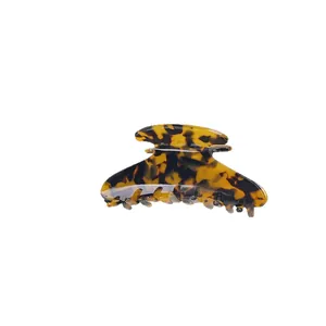 Polished tortoiseshell acetate hair claw clip with leopard pattern for hair styling