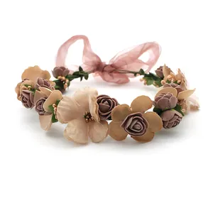 Floral headband with pink blossoms, green leaves and organza ribbon for weddings