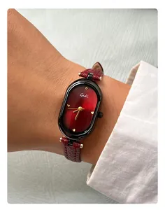 Detail of Gedi oval quartz watch with deep red gradient dial and wine red leather strap
