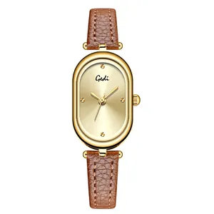 Elegant vintage oval watch with golden case and brown leather strap for women