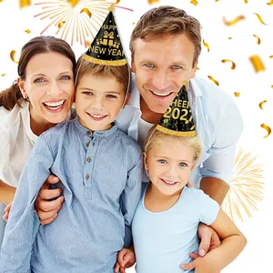 Family wearing black and gold New Year party hats with Happy New Year printed text