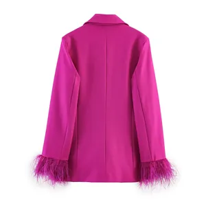 Detail of fuchsia blazer back view showing ostrich feather cuffs and sleek fabric