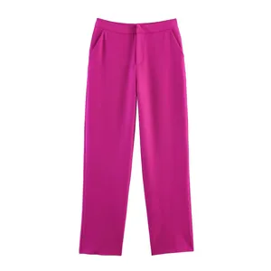 Detail of high-waist straight-leg dress trousers in vibrant fuchsia pink woven fabric