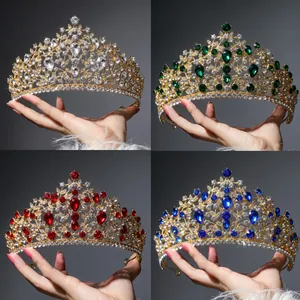 Macro display of four luxury baroque crowns with red, blue, and green crystals