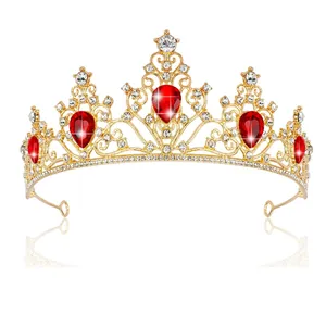 Detail of luxury bridal tiara with red teardrop gemstones and gold base plating