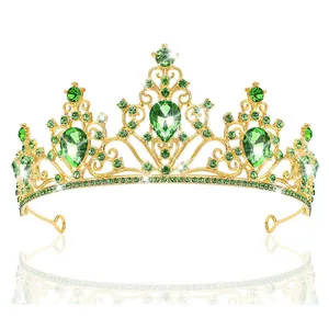 Macro detail of luxury gold bridal crown with vintage emerald green crystal accents