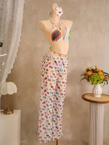 Three-piece bikini set with tropical fruit print and matching high-waisted pants