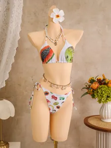 Close-up of tropical fruit print and halter neck ties on this bikini set