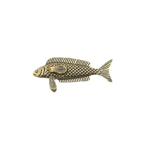 Detailed macro view of vintage solid brass stingray figurine showing fish scales texture