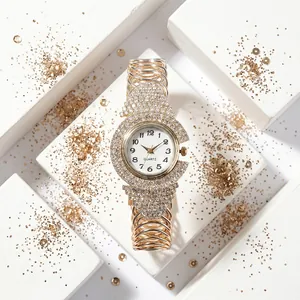 Macro shot of gold quartz watch with rhinestones and multi-layered bracelet band