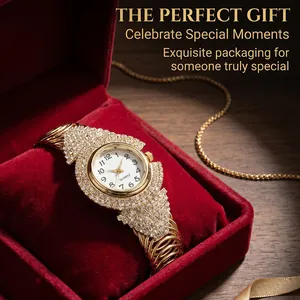Detail of luxury gold quartz watch with crystals in a red velvet gift box