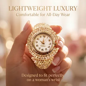 Detailed close-up of a gold quartz watch with full crystal embellishments and diamonds