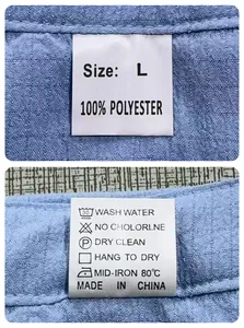 Detail shot of the care label on men's light blue waffle fabric set showing size L