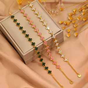 Detailed macro view of S925 engraved clasp on triple clover gold-plated bracelet