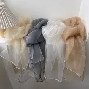 Lightweight sheer scarves with gold stripes in beige, charcoal, white, and tan colors