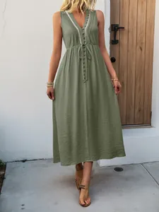 Detail view of olive green V-neck maxi dress featuring pleated bodice and drawstring waist