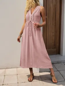 Detail of V-neck sleeveless dress with pleated shoulders and button-up front in lotus pink