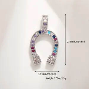 Detailed view of horseshoe pendant with colorful gems and size specifications